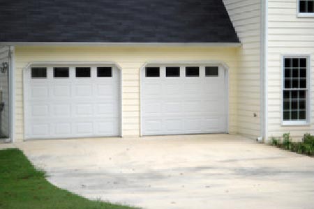Two white garage doors